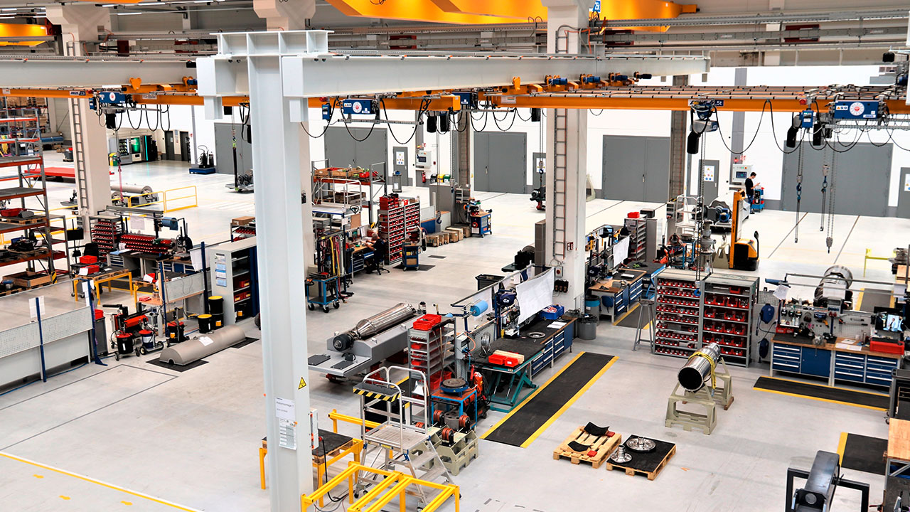 Flottweg centrifuges factory hall with many workbenches.