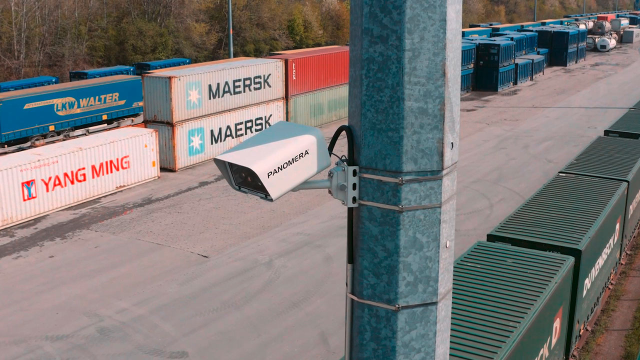 Panomera® camera at Container Terminal Herne. Panomera® camera hanging on a mast, logistics containers in the background.